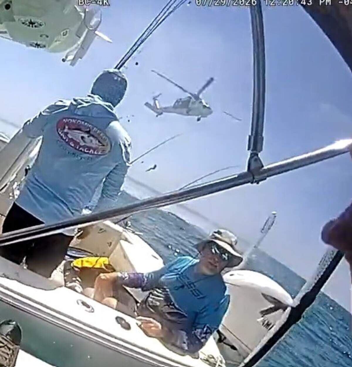 A U.S. Navy search and rescue helicopter prepares to depart from the scene where its crew and Florida Fish and Wildlife Conservation Commission officers rescued three men who went missing while diving for spiny lobster on Wednesday, July 29, 2026.